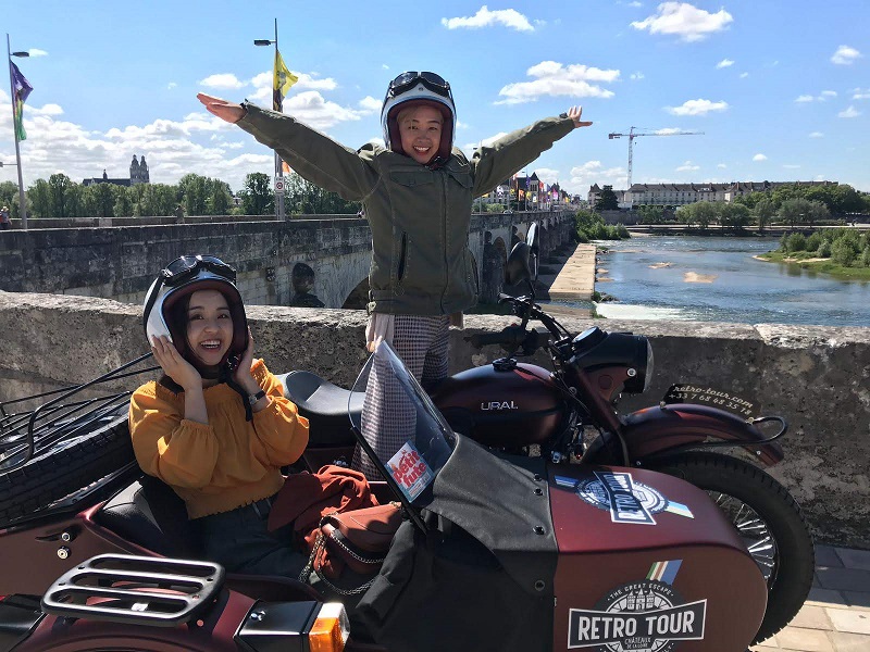 Retro tour: touring Loire valley with a vintage side-car. France.